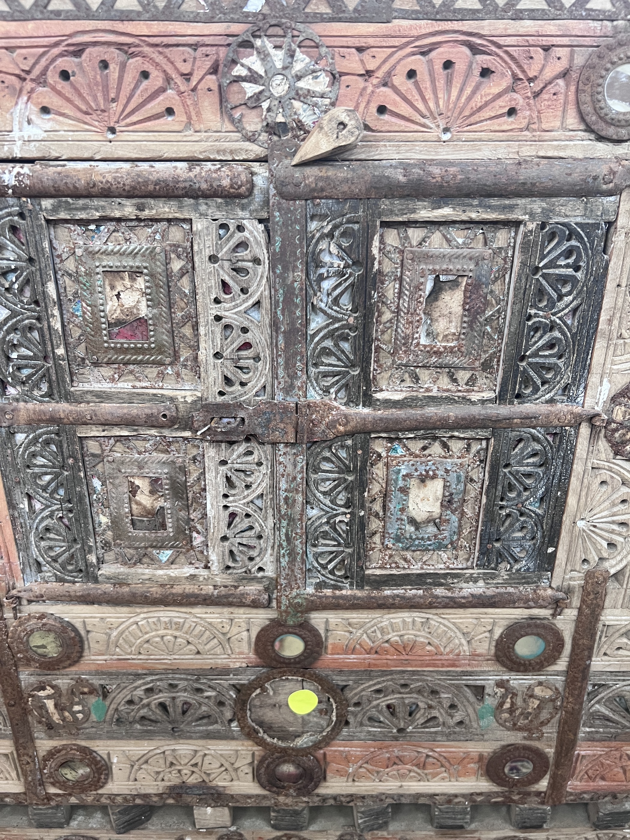 An Indian painted carved hardwood cabinet, width 124cm, depth 43cm, height 125cm